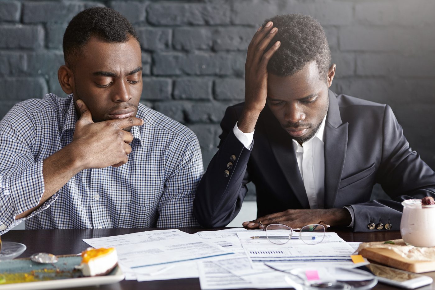 Researchers reviewing grant documents